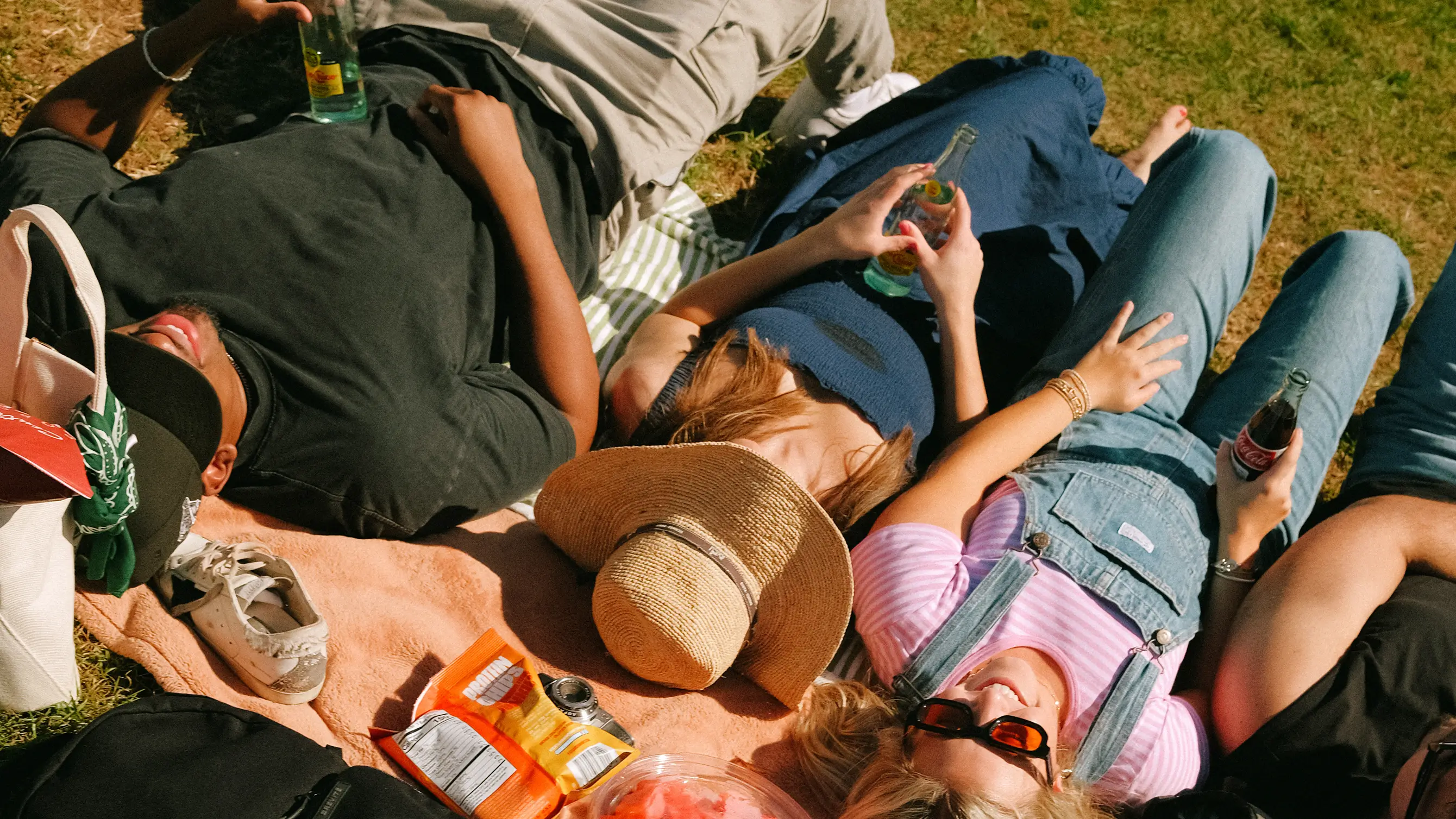 a group of friends laying down outside